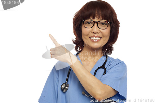 Image of Nurse pointing at the copy space
