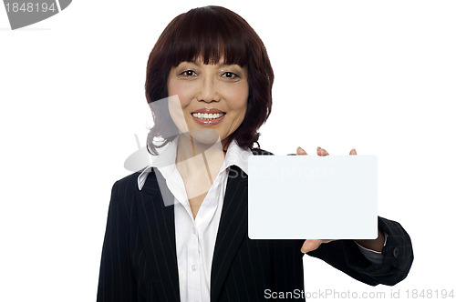 Image of Business lady showing blank placard to camera