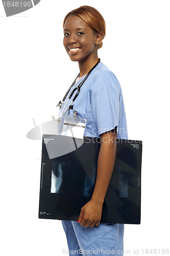 Image of Nurse carrying x-ray reports to doctor