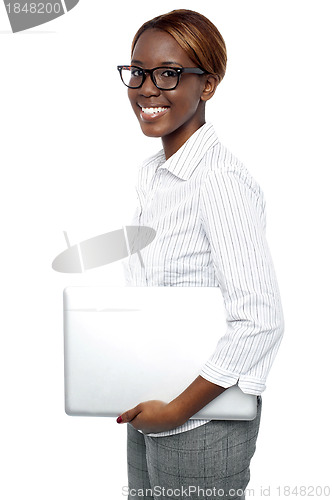 Image of Cheerful business consultant carrying laptop