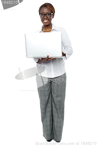 Image of Female business secretary working on laptop