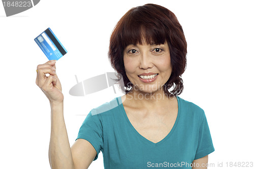 Image of Beautiful woman holding her credit card out