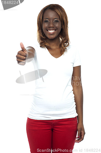 Image of African teenage girl gesturing thumbs up