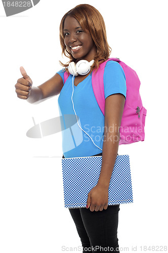 Image of Stylish african college girl showing thumbs up