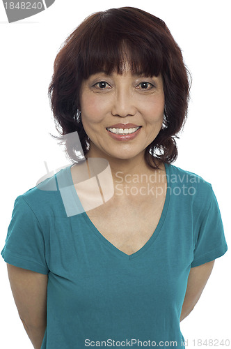 Image of Picture of a smiling asian lady posing casually