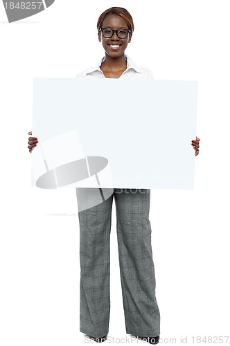 Image of Corporate woman holding blank white billboard