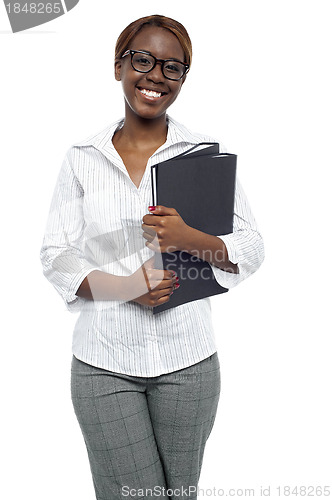 Image of Female representative posing with file folder