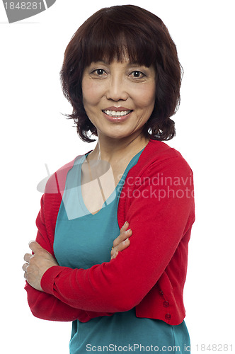 Image of Asian woman posing with her arms crossed