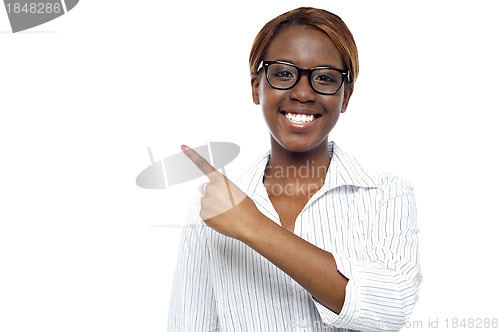 Image of Female consultant pointing at copy space area