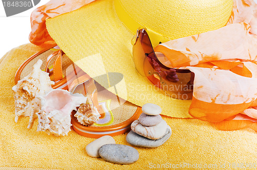Image of Beach  items a hat, a towel and slippers, it is isolated on whit