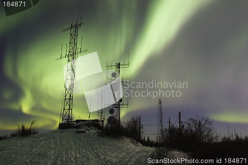 Image of SCientific antennas under night sky with northern lights