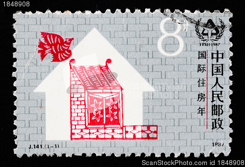 Image of A stamp printed in China shows International Year of shelter