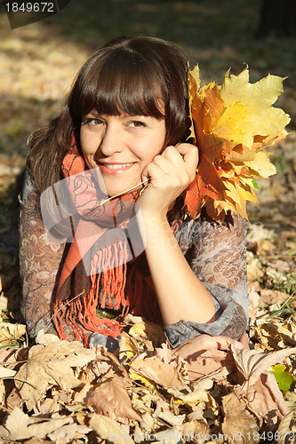 Image of woman with autumn leaves 