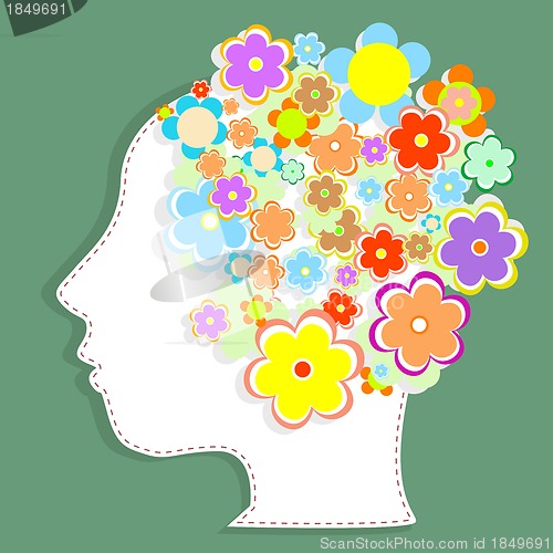 Image of silhouette of a woman's head filled with cute flowers