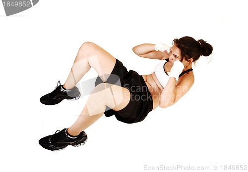 Image of Girl doing sit-ups.