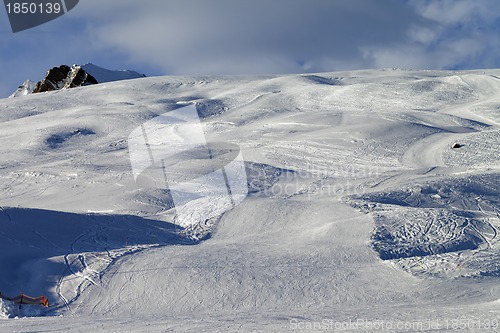 Image of Snow skiing piste in evening