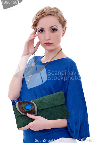 Image of  woman holding purse and necklace