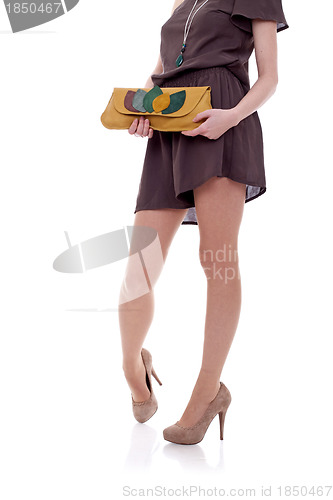 Image of dress,purse, legs and high heels