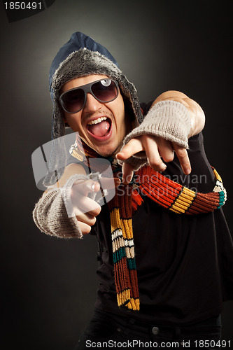 Image of excited young man pointing