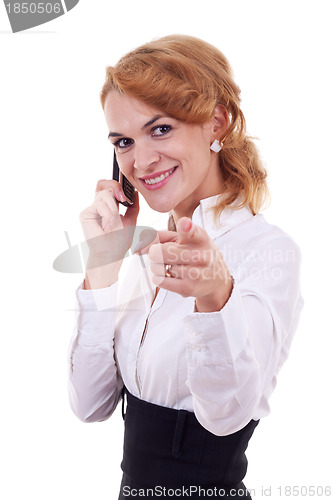 Image of woman on mobile phone pointing 