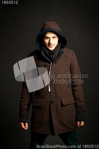 Image of man wearing a hooded coat