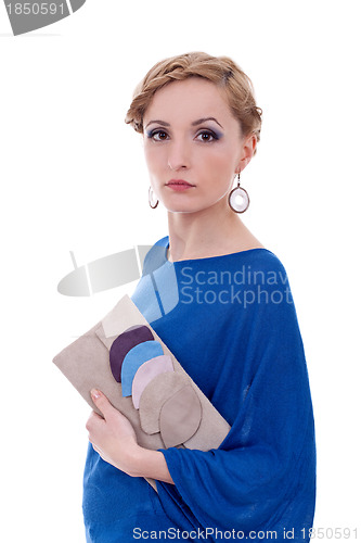 Image of young woman holding purse 