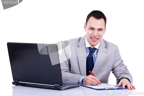 Image of business man signing some papers