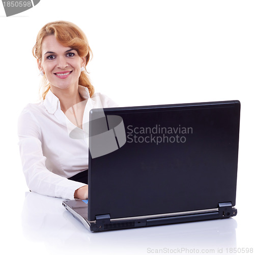 Image of business woman sitting at her desk