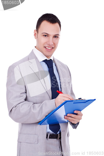 Image of Business man signing papers