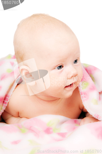 Image of Little baby under multicolored towel