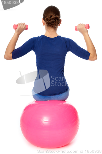 Image of Exercises with dumbbells on a gymnastic ball