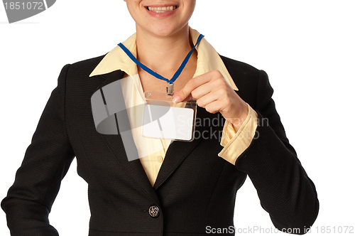 Image of woman showing her badge
