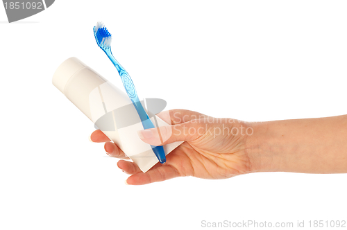 Image of Toothpaste and blue toothbrush