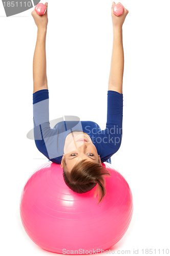 Image of Exercises with dumbbells on a gymnastic ball