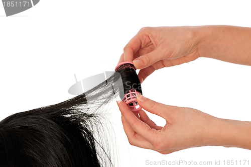 Image of hairdresser makes curls