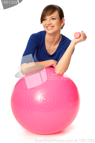 Image of Exercises with dumbbells on a gymnastic ball