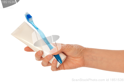 Image of Toothpaste and blue toothbrush