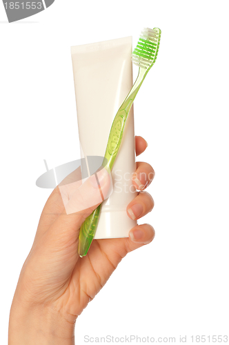 Image of Toothpaste and green toothbrush