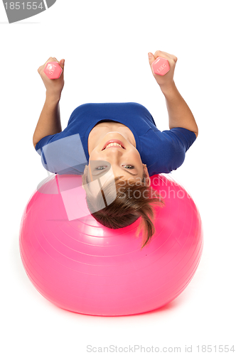 Image of Exercises with dumbbells on a gymnastic ball