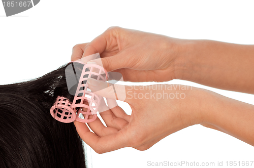 Image of hairdresser makes curls