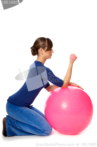 Image of Exercises with dumbbells on a gymnastic ball