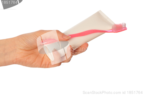 Image of Toothpaste and pink toothbrush