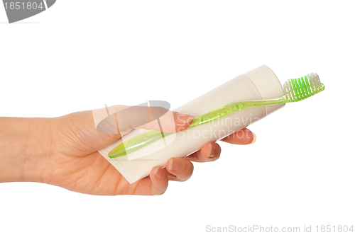 Image of Toothpaste and green toothbrush