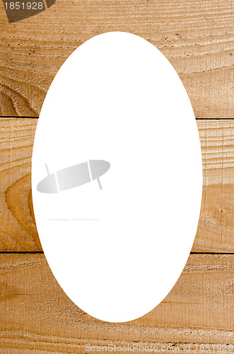 Image of Wooden wall boards and white oval in center 