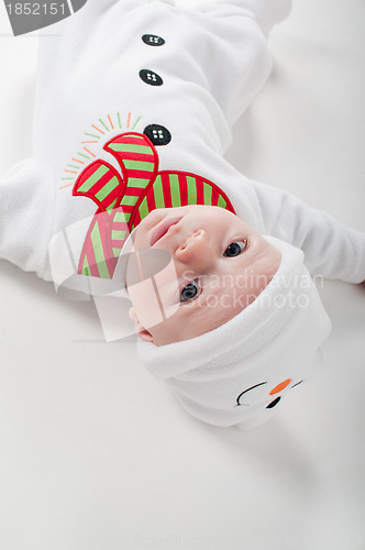 Image of Baby boy in snowman costume watching on you