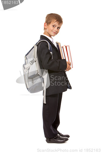 Image of Boy holding books. Back to school