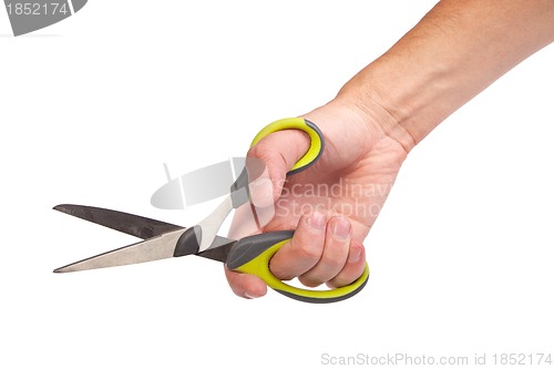 Image of Hand is holding scissors isolated