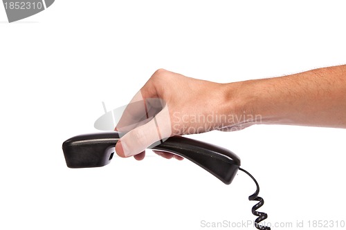 Image of Hand holding an old black telephone tube