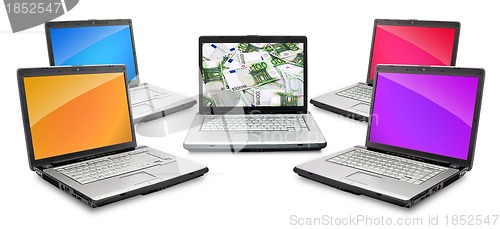 Image of Open laptop with money 