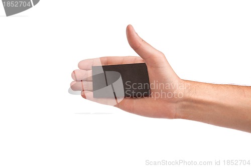 Image of Businessman's hand holding blank business card